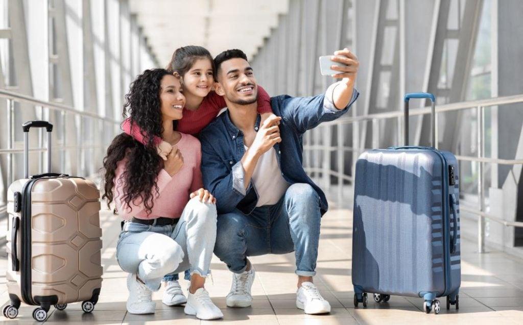 A family records the beginning of their vacation