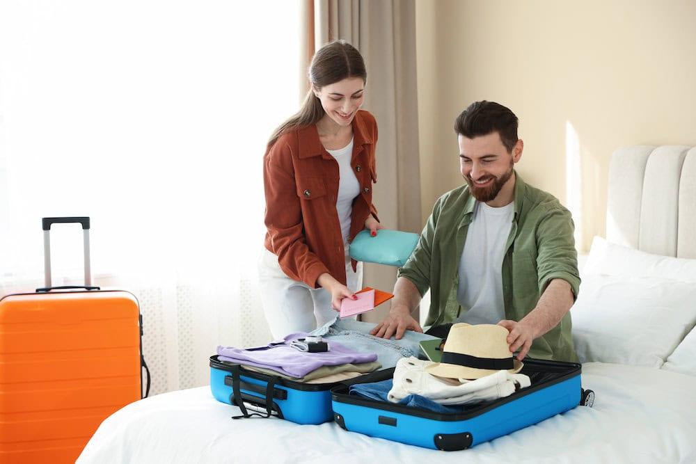 Couple unpacking at a hotel before exploring activities for couples in Bangkok