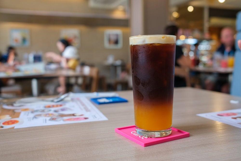 Iced americano on a table in. Plenty of cafes near Sathorn serve good drinks and more