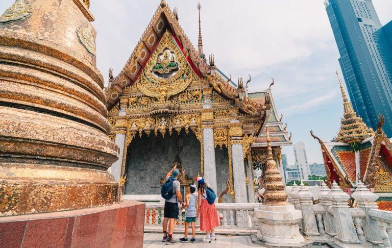 A family visits one of Bangkok’s old temples. An essential part of any 3-day itinerary in Bangkok.