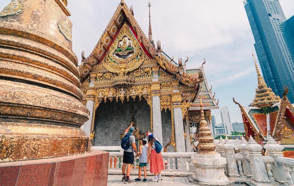 A family visits one of Bangkok’s old temples. An essential part of any 3-day itinerary in Bangkok.
