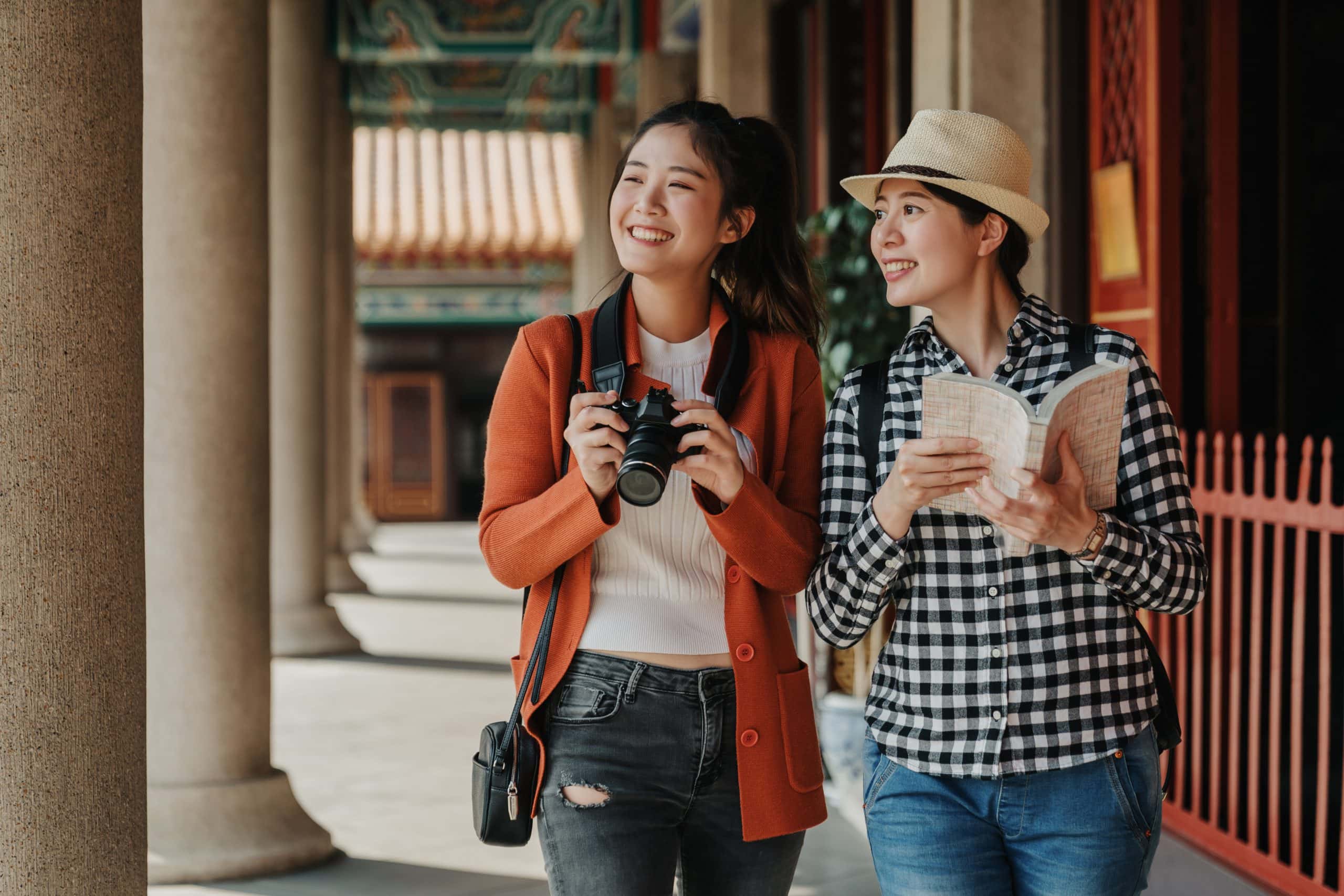 Two girls visiting one of the temples in Bangkok during their trip to Thailand.