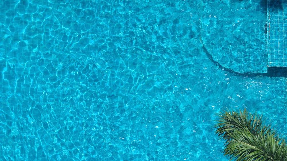 An aerial view of a rooftop pool, one factor to weigh on a hotel pool checklist.